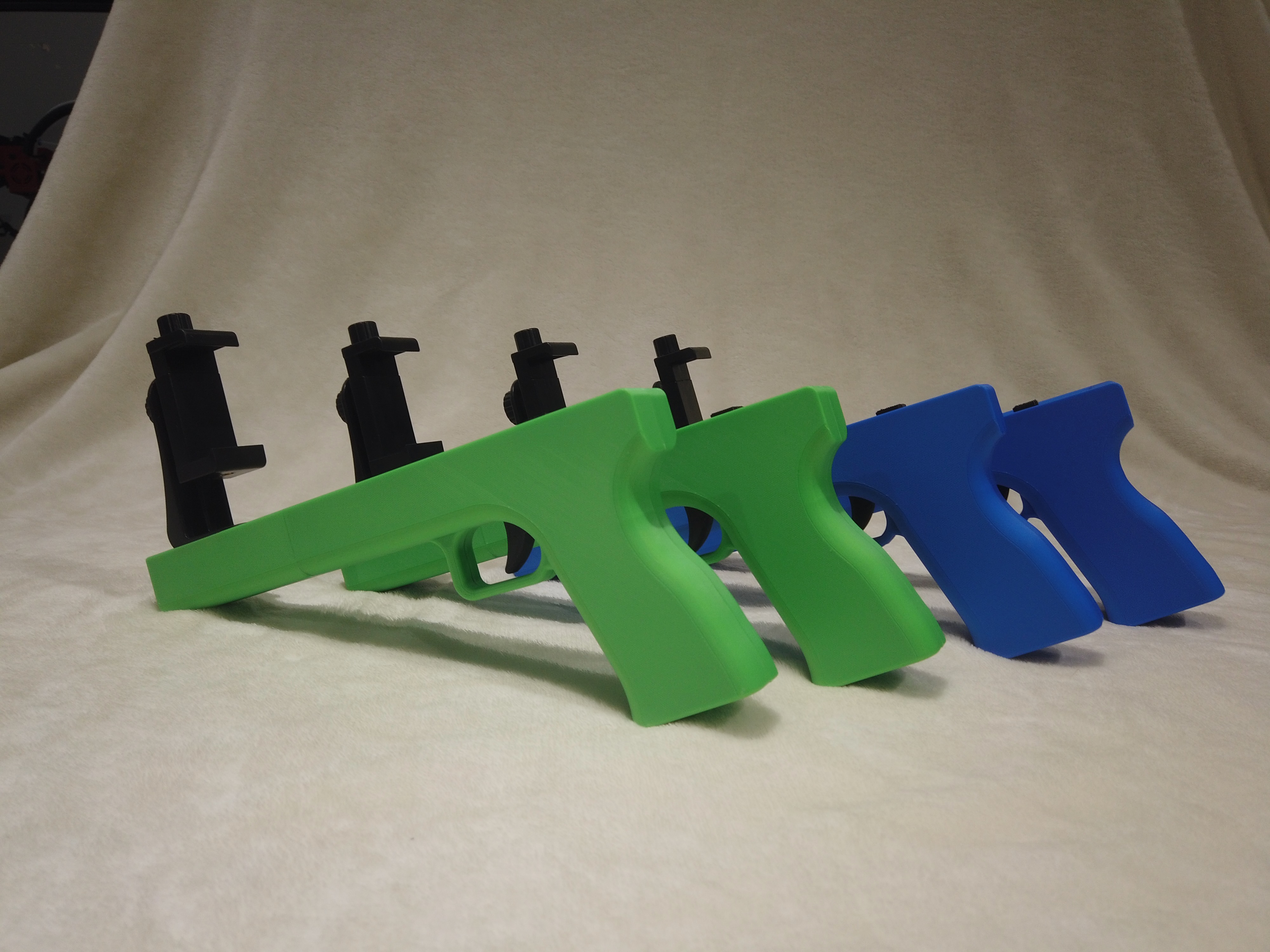 Finished WarStrike controllers in green and blue colorways